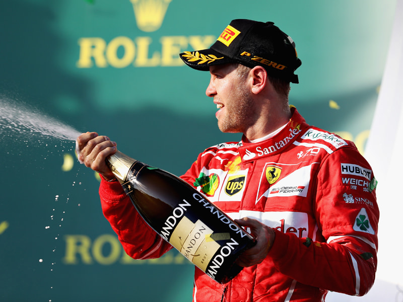 &#220;bersch&#228;umende Freude: Ferrari-Pilot Sebastian Vettel bei der Champagnerdusche. 