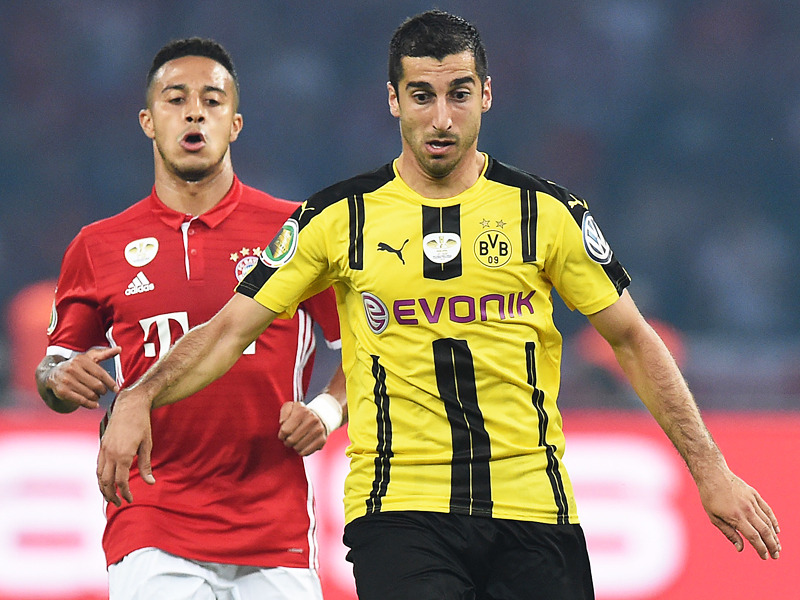 Bei 40 Millionen Euro könnte die letzte Hemmschwelle fallen: Henrikh Mkhitaryans Verbleib beim BVB ist nicht sicher. Links Bayerns Thiago.