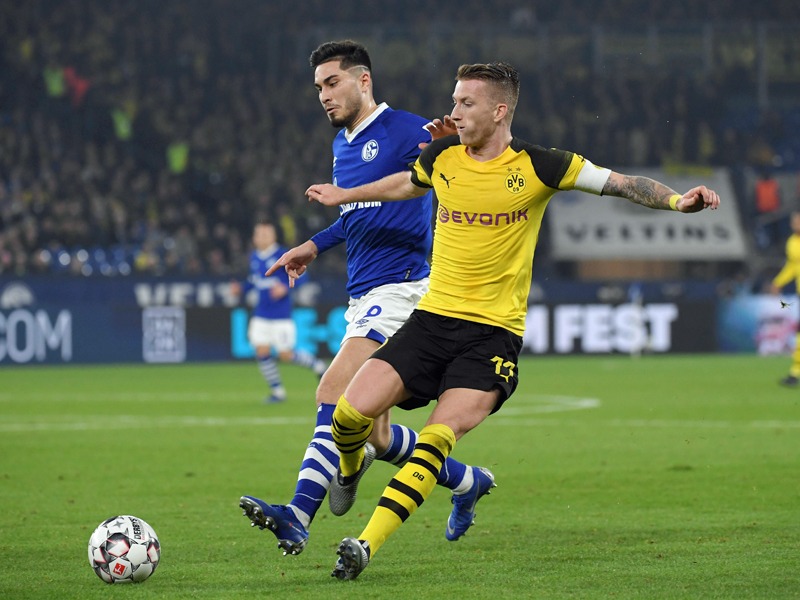 Schalkes Serdar im Duell mit BVB-Kapitän Reus