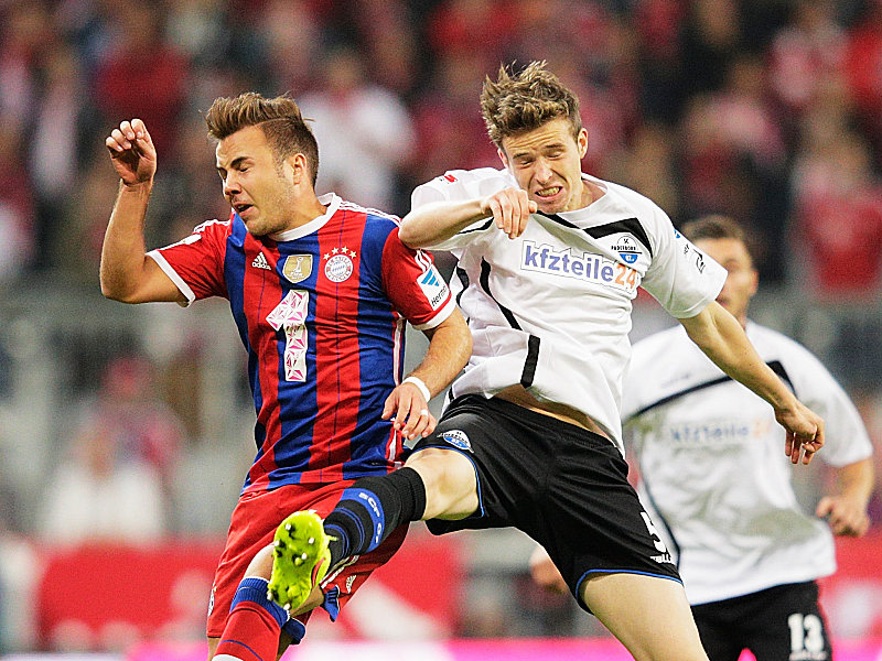 Augen zu und durch: Bayerns Götze im Duell mit Ziegler (re.).