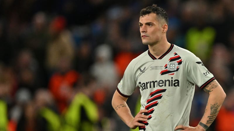 Bayer Leverkusen's Swiss midfielder #34 Granit Xhaka reacts on the pitch after the UEFA Europa League final football match between Atalanta and Bayer Leverkusen at the Dublin Arena stadium, in Dublin, on May 22, 2024. Atalanta won the game 3-0. (Photo by Glyn KIRK / AFP) (Photo by GLYN KIRK/AFP via Getty Images)