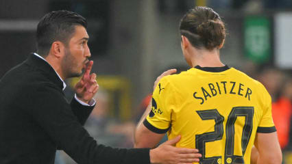 Borussia Dortmund's Turkish coach Nuri Sahin (L) speaks with Borussia Dortmund's Austrian midfielder #20 Marcel Sabitzer during the UEFA Champions League's 1st round day 1 football match between Club Brugge KV and Borussia Dortmund at the Jan Breydel Stadium in Bruges on September 18, 2024. (Photo by NICOLAS TUCAT / AFP) (Photo by NICOLAS TUCAT/AFP via Getty Images)