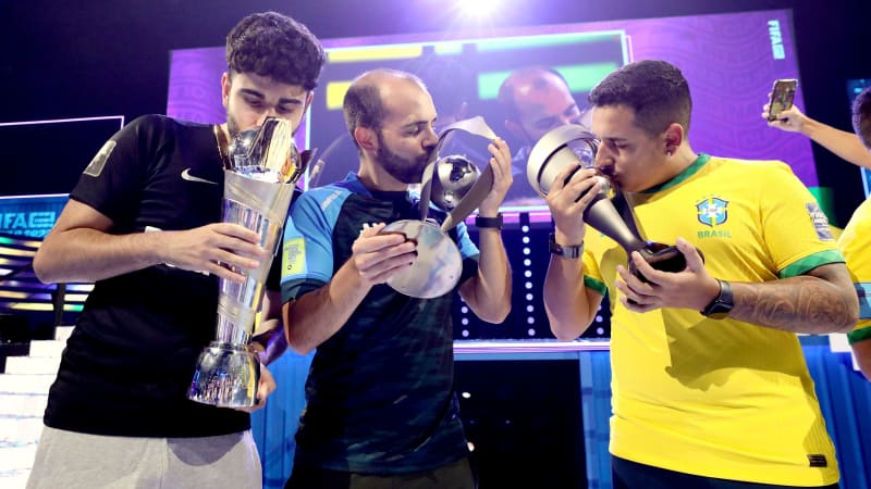 COPENHAGEN, DENMARK - JULY 30: Umut Gultekin (Umut) of Germany; Paulo Henrique de Souza Ferreira Chaves (Phzin) of Brazil and Diogo Eurico Fidalgo Pombo (Tuga810) celebrates with the FIFAe Nations cup after winning the Final match between Brazil and Poland as part of the FIFAe Nations Cup 2022 on July 30, 2022 in Copenhagen, Denmark. (Photo by Joe Brady - FIFA/FIFA via Getty Images)