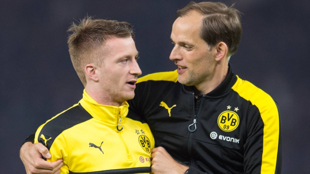 Kennen sich, sind in Dortmund zusammen Pokalsieger geworden (2017) und sehen sich nun wieder: Dortmunds Kapitän Marco Reus und Bayern-Trainer Thomas Tuchel.