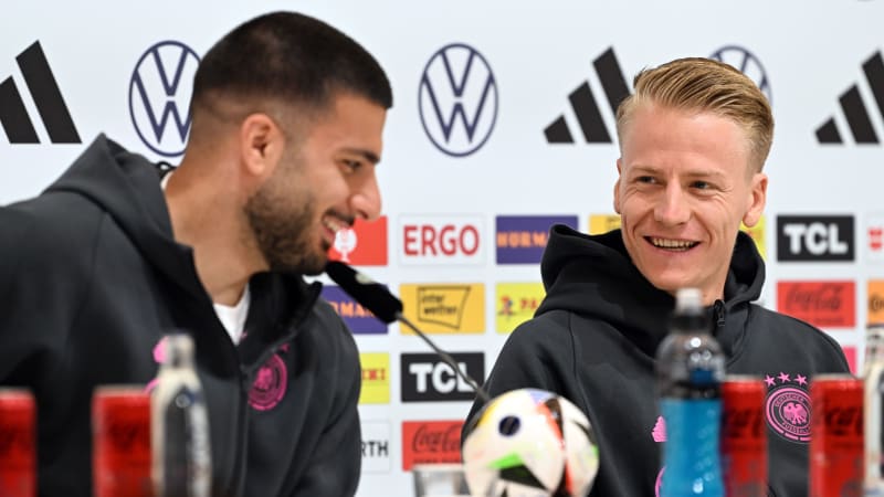 HERZOGENAURACH, GERMANY - JUNE 21: Chris Führich of Germany talks next to his team mate Deniz Undav to the media during a press conference at adidas HQ Herzo-Base on June 21, 2024 in Herzogenaurach, Germany. (Photo by Alexander Hassenstein/Getty Images)