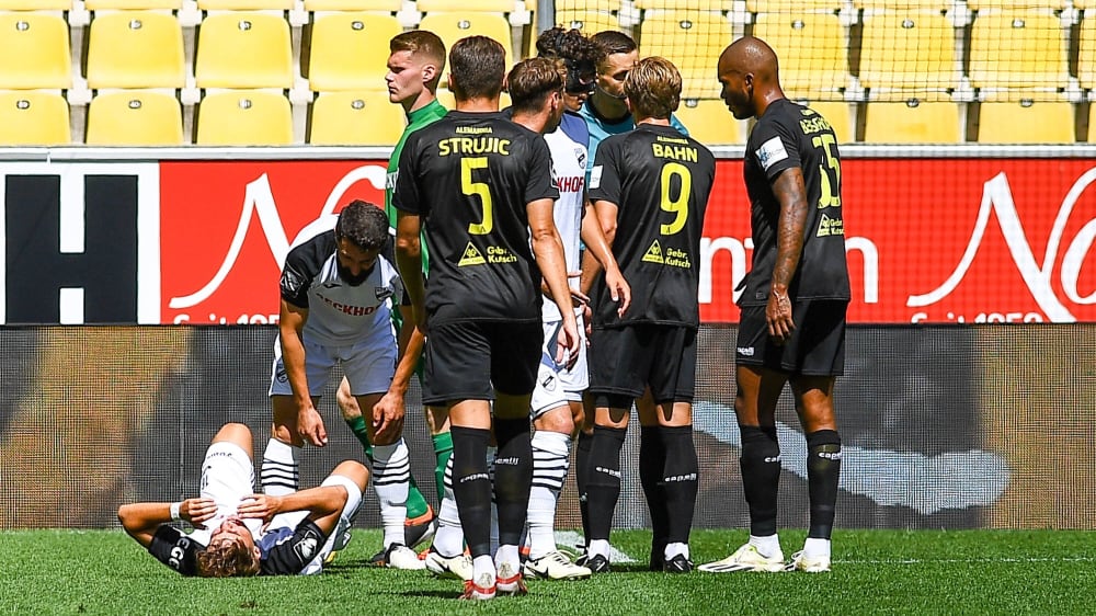 Max Schulz (left) had to leave the game with a suspected syndesmotic tear after a foul by Charleson Benshop (right).
