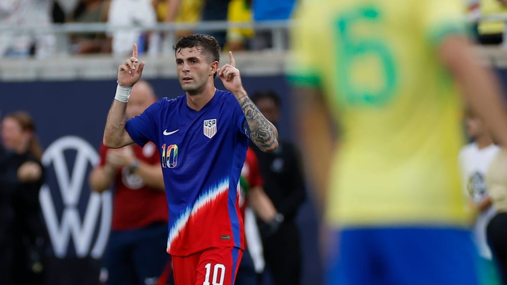 Free kick win: Christian Pulisic celebrates against Brazil.
