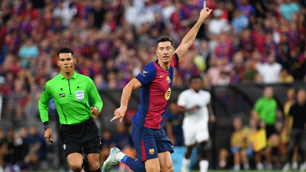 Pictured: Robert Lewandowski scored twice against AC Milan.