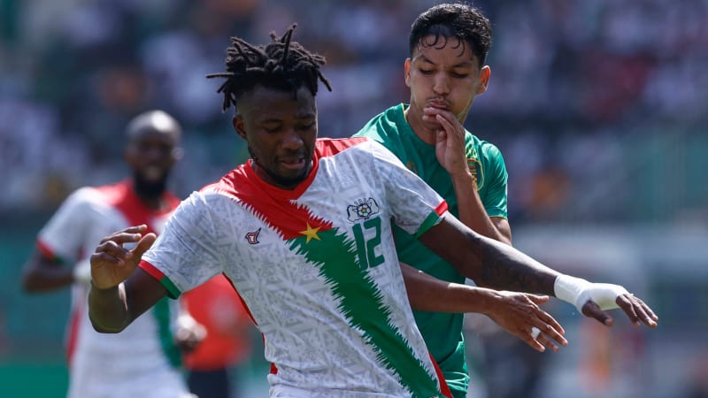 Burkina Faso's defender #12 Edmond Tapsoba fights for the ball with Mauritania's forward #9 Hemeya Tanji (R) during the Africa Cup of Nations (CAN) 2024 group D football match between Burkina Faso and Mauritania at Stade de la Paix in Bouake on January 16, 2024. (Photo by KENZO TRIBOUILLARD / AFP) (Photo by KENZO TRIBOUILLARD/AFP via Getty Images)