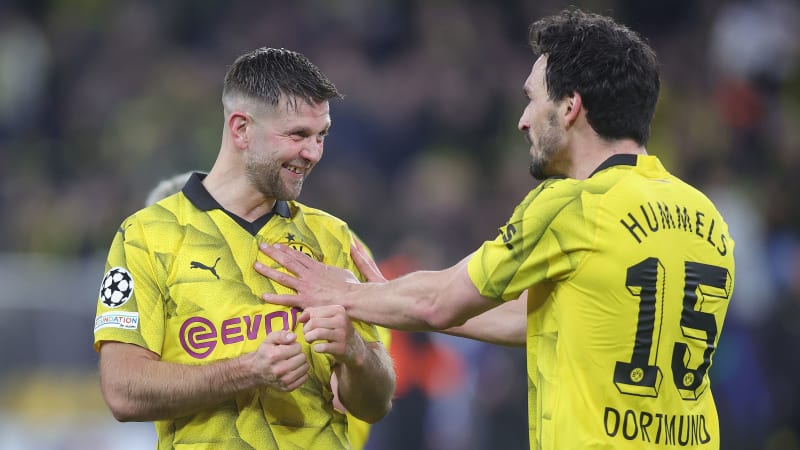 DORTMUND, GERMANY - APRIL 16: (L.R:) Niclas Füllkrug and Mats Hummels of Borussia Dortmund celebrate after the UEFA Champions League quarter-final second leg match between Borussia Dortmund and Atletico Madrid at Signal Iduna Park on April 16, 2024 in Dortmund, Germany.(Photo by Jan Fromme - firo sportphoto/Getty Images)