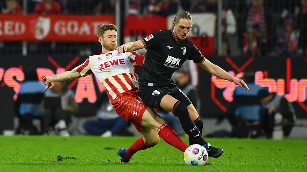 Trennten sich in einem umkämpften Spiel 1:1: Der 1. FC Köln mit Florian Kainz (li.) und die Augsburger mit Frederik Jensen.