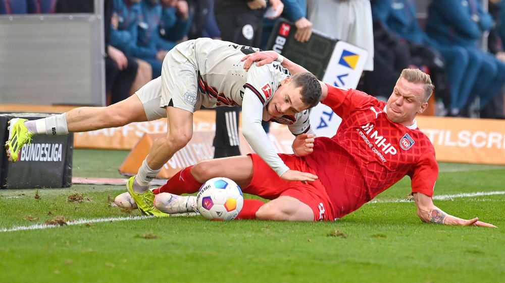 Heidenheims Lennard Maloney (re.) ist nach aktuellem Stand der laufstärkste Spieler in der Bundesliga.