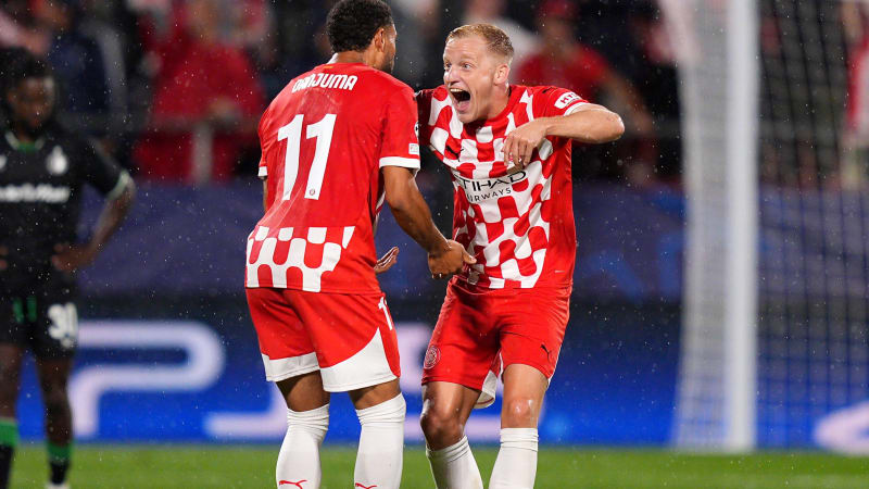 GIRONA, SPAIN - OCTOBER 02: Donny van de Beek of Girona FC celebrates scoring his team's second goal with teammate Arnaut Danjuma during the UEFA Champions League 2024/25 League Phase MD2 match between Girona FC and Feyenoord at Montilivi Stadium on October 02, 2024 in Girona, Spain. (Photo by Pedro Salado/Getty Images)