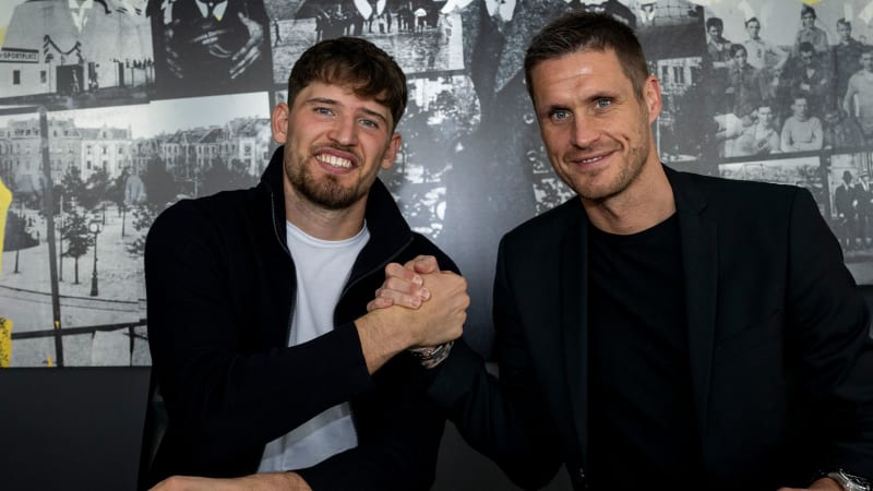 DORTMUND, GERMANY - OCTOBER 5: Gregor Kobel of Borussia Dortmund poses with sporting director Sebastian Kehl after he extended his contract on October 5, 2023 in Dortmund, Germany. Kobel extended his contract at BVB ahead of schedule by a further two years until June 2028. (Photo by Hendrik Deckers/Borussia Dortmund via Getty Images)