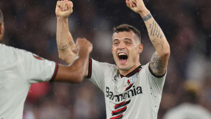 LONDON, ENGLAND - APRIL 18: Granit Xhaka of Bayer Leverkusen celebrates with Jonathan Tah of Bayer Leverkusen during the UEFA Europa League 2023/24 Quarter-Final second leg match between West Ham United FC and Bayer 04 Leverkusen at Olympic Stadium on April 18, 2024 in London, England.(Photo by Catherine Ivill - AMA/Getty Images)