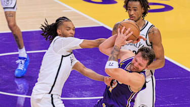 March 27, 2026, Los Angeles, California, USA: Luka Doncic 77 of the Los Angeles Lakersis defended by Ziaire Williams 1 of the Brooklyn Nets during a regular season NBA, Basketball Herren, USA game on Friday March 27, 2026 at Crypto.com Arena in Los Angeles, California. Lakers defeat Nets, 116-99. JAVIER ROJAS PI Lakers Defeat Nets, 116-99 PUBLICATIONxINxGERxSUIxAUTxONLY - ZUMAp124 20260327_zaa_p124_080 Copyright: xJavierxRojasx