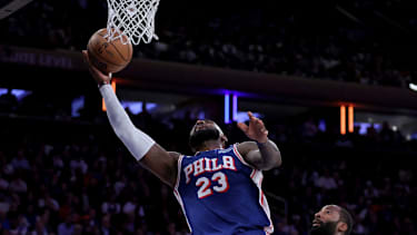 Oct 20, 2026; New York, New York, USA; Philadelphia 76ers forward LeBron James (23) drives to the basket against New York Knicks center Andre Drummond (0) during the fourth quarter at Madison Square Garden. Mandatory Credit: Brad Penner-Imagn Images     TPX IMAGES OF THE DAY
