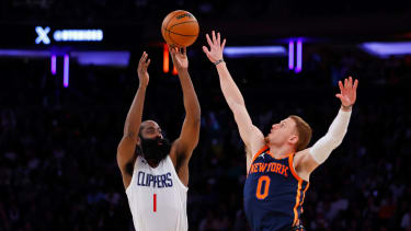 NEW YORK, NEW YORK - NOVEMBER 6: James Harden #1 of the LA Clippers makes a shot as Donte DiVincenzo #0 of the New York Knicks defends during the fourth quarter of a game at Madison Square Garden on November 6, 2023 in New York City. The Knicks defeated the Clippers 111-97. NOTE TO USER: User expressly acknowledges and agrees that, by downloading and or using this photograph, User is consenting to the terms and conditions of the Getty Images License Agreement. (Photo by Rich Schultz/Getty Images)