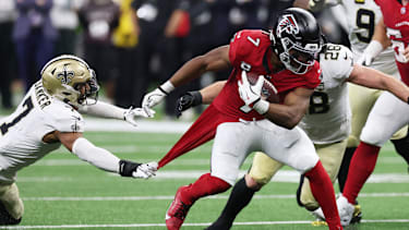 Oct 5, 2026; New Orleans, Louisiana, USA;  Atlanta Falcons running back Bijan Robinson (7) runs against New Orleans Saints safety Jonas Sanker (7) during the first half at Caesars Superdome.  Mandatory Credit: Stephen Lew-Imagn Images