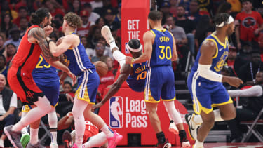 Apr 23, 2025; Houston, Texas, USA; Golden State Warriors forward Jimmy Butler III (10) falls to the floor and suffers an apparent injury during the first quarter during game two of the first round for the 2024 NBA Playoffs against the Houston Rockets at Toyota Center. Mandatory Credit: Troy Taormina-Imagn Images