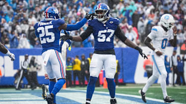 New York Giants defensive lineman Chauncey Golston (57) and New York Giants safety Jason Pinnock (25) celebrate during a game against the Tennessee Titans at MetLife Stadium, Sep 27, 2026, East Rutherford, NJ, USA.