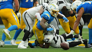 Sep 20, 2026; Inglewood, California, USA;  Las Vegas Raiders linebacker Nakobe Dean (17) forces a fumble against Los Angeles Chargers running back Omarion Hampton (8) during the second half at SoFi Stadium.  Mandatory Credit: Kirby Lee-Imagn Images
