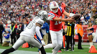Oct 11, 2026; Foxborough, Massachusetts, USA;  New England Patriots quarterback Drake Maye (10) runs for a three-yard touchdown against Las Vegas Raiders cornerback Darien Porter (26) during the third quarter at Gillette Stadium.  Mandatory Credit: Bob DeChiara-Imagn Images