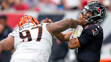 Cincinnati Bengals defensive tackle Dexter Lawrence II (97) drives into Houston Texans quarterback C.J. Stroud (7) as he throws in the fourth quarter of the NFL Week 2 game between the Houston Texans and the Cincinnati Bengals at Reliant Stadium in Houston on Sunday, Sept. 20, 2026. The Bengals improved to 2-0 on the season with a 20-6 win on the road.