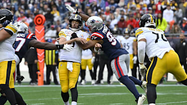 Sep 20, 2026; Foxborough, Massachusetts, USA;  Pittsburgh Steelers quarterback Aaron Rodgers (8) is hit by New England Patriots linebacker Elijah Ponder (91) in the first half at Gillette Stadium.  Mandatory Credit: Eric Canha-Imagn Images