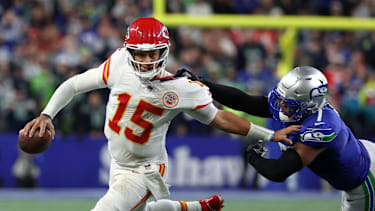 Oct 25, 2026; Seattle, Washington, USA;  Kansas City Chiefs quarterback Patrick Mahomes (15) scrambles with the ball defended by Seattle Seahawks linebacker Uchenna Nwosu (7) during the third quarter at Lumen Field.  Mandatory Credit: Joe Nicholson-Imagn Images