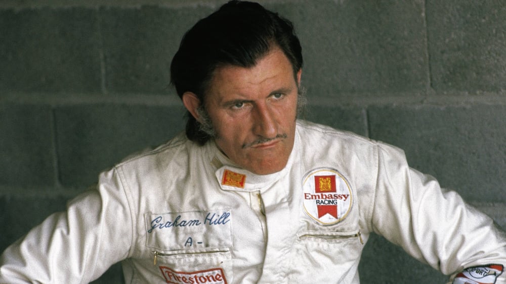 Graham hill. Грэм Хилл. Грэм Хилл гонщик. 5. Джон Грэм гонщик. Грэм Хилл гонщик формулы 1 шлем.