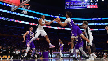 Nov 5, 2025; Los Angeles, California, USA; San Antonio Spurs forward Keldon Johnson (3) plays for the ball against Los Angeles Lakers center Jaxson Hayes (11) during the second half at Crypto.com Arena. Mandatory Credit: Gary A. Vasquez-Imagn Images