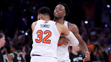 Jun 10, 2026; New York, New York, USA; New York Knicks center Karl-Anthony Towns (32) hugs forward OG Anunoby (8) after Anunoby's go ahead basket late during the fourth quarter of game four of the 2026 NBA Finals against the San Antonio Spurs at Madison Square Garden. Mandatory Credit: Brad Penner-Imagn Images