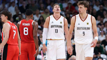 LILLE, FRANCE - JULY 27: Moritz Wagner #13 of Team Germany and Franz Wagner #9 of Team Germany react during the Men's Group Phase - Group A match between Australia and Spain on day one of the Olympic Games Paris 2024 at Pierre Mauroy Stadium on July 27, 2024 in Lille, France. (Photo by Gregory Shamus/Getty Images)