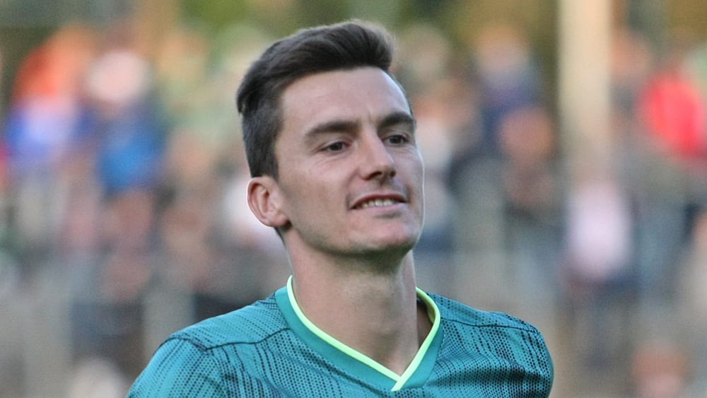 FC Homburg-Spieler Tim Steger lacht.