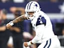 ARLINGTON, TEXAS - SEPTEMBER 20: Dak Prescott #4 of the Dallas Cowboys celebrates after a touchdown pass against the Washington Commanders in the fourth quarter of a game at AT&T Stadium on September 20, 2026 in Arlington, Texas. (Photo by Stacy Revere/Getty Images)
