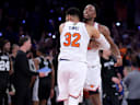 Jun 10, 2026; New York, New York, USA; New York Knicks center Karl-Anthony Towns (32) hugs forward OG Anunoby (8) after Anunoby's go ahead basket late during the fourth quarter of game four of the 2026 NBA Finals against the San Antonio Spurs at Madison Square Garden. Mandatory Credit: Brad Penner-Imagn Images