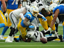 Sep 20, 2026; Inglewood, California, USA;  Las Vegas Raiders linebacker Nakobe Dean (17) forces a fumble against Los Angeles Chargers running back Omarion Hampton (8) during the second half at SoFi Stadium.  Mandatory Credit: Kirby Lee-Imagn Images