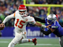 Oct 25, 2026; Seattle, Washington, USA;  Kansas City Chiefs quarterback Patrick Mahomes (15) scrambles with the ball defended by Seattle Seahawks linebacker Uchenna Nwosu (7) during the third quarter at Lumen Field.  Mandatory Credit: Joe Nicholson-Imagn Images