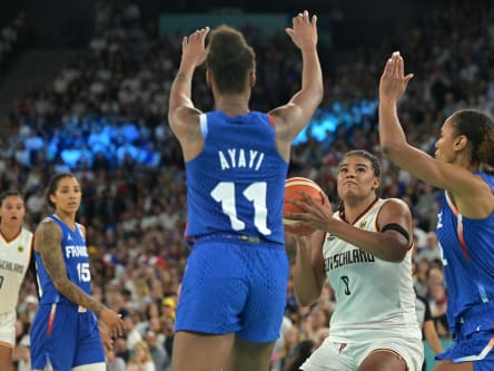 France's #11 Valeriane Ayayi defends against Germany's #08 Nyara Sabally trying to go to the basket in the women's quarterfinal basketball match between Germany and France during the Paris 2024 Olympic Games at the Bercy Arena in Paris on August 7, 2024. (Photo by Damien MEYER / AFP) (Photo by DAMIEN MEYER/AFP via Getty Images)