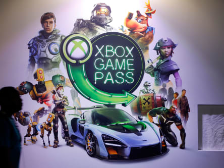 PARIS, FRANCE - OCTOBER 25: A visitor walks past an poster of the Microsoft subscription service "Xbox Game Pass" during the 'Paris Games Week' on October 25, 2018 in Paris, France. 'Paris Games Week' is an international trade fair for video games and runs from October 26 to 31, 2018. (Photo by Chesnot/Getty Images)