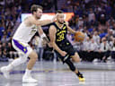 Oct 30, 2026; San Francisco, California, USA; Golden State Warriors guard Stephen Curry (30) drives in against Los Angeles Lakers guard Luka Doncic (77) during the fourth quarter at Chase Center. Mandatory Credit: Kelley L Cox-Imagn Images