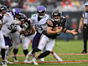 Sep 20, 2026; Chicago, Illinois, USA;  Chicago Bears quarterback Caleb Williams (18) scrambles against Minnesota Vikings linebacker Dallas Turner (15) and defensive tackle Levi Drake Rodriguez (50) during the first quarter at Soldier Field.  Mandatory Credit: Patrick Gorski-Imagn Images