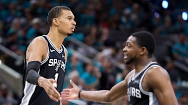 SAN ANTONIO, TEXAS - MAY 22: Victor Wembanyama #1 and De'aaron Fox #4 of the San Antonio Spurs high five during the third quarter against the Oklahoma City Thunder in Game Three of the NBA Western Conference Finals at Frost Bank Center on May 22, 2026 in San Antonio, Texas. NOTE TO USER: User expressly acknowledges and agrees that, by downloading and or using this photograph, User is consenting to the terms and conditions of the Getty Images License Agreement. (Photo by Alex Slitz/Getty Images)