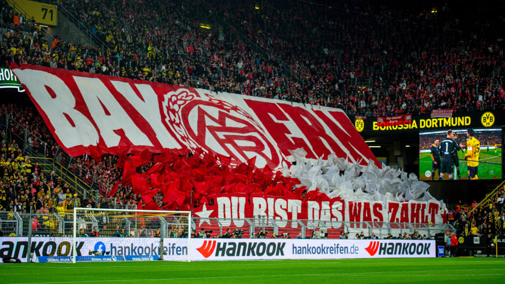 Support auf Achse: Immer wieder reisen Anhänger mit ihren Lieblingen zu Auswärtsspielen, hier FCB-Fans beim BVB.