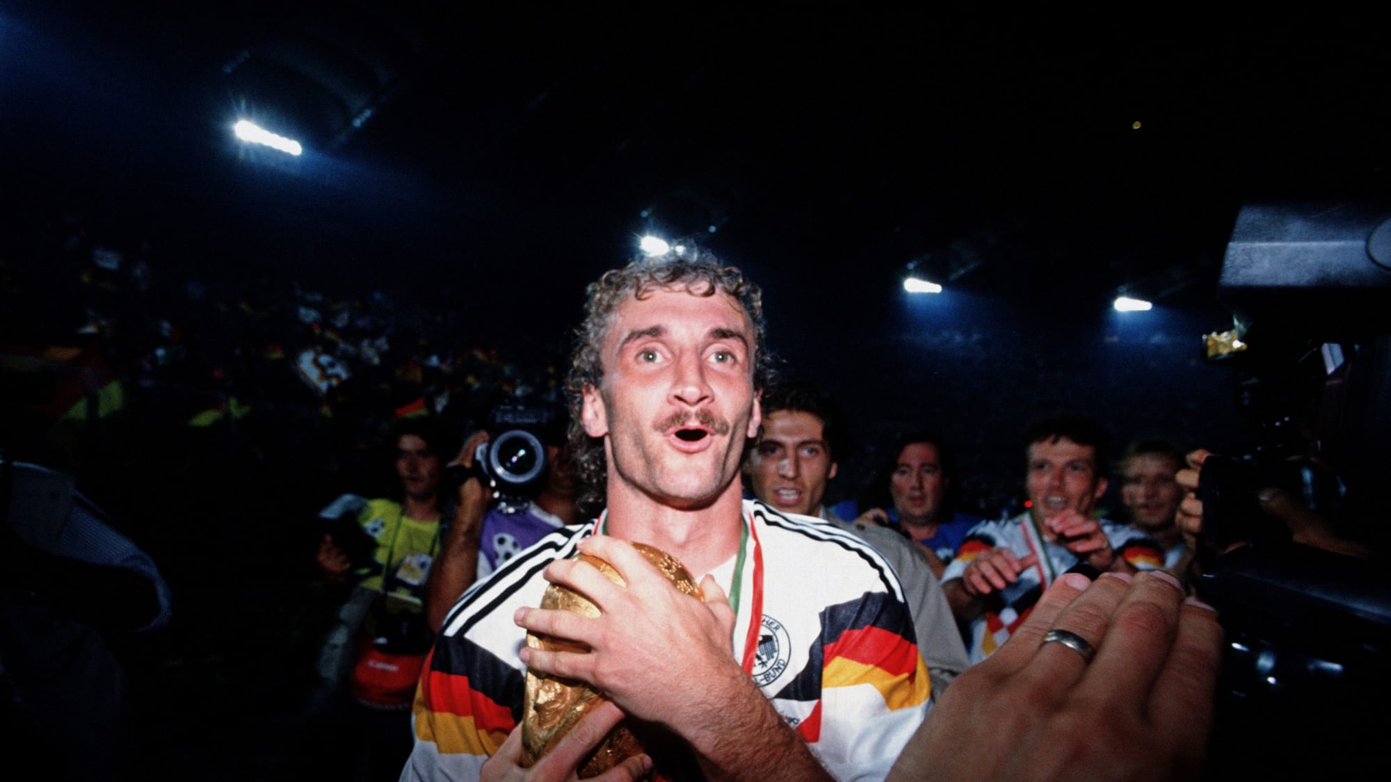 ROME, ITALY - JULY 08:  Rudi Voeller of Germany holds the trophy after the German team won the FIFA World Championship final match between Argentina and Germany on July 8, 1990 in Rome, Italy. Germany won the match 1:0(Photo by Bongarts/Getty Images) 