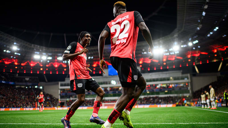LEVERKUSEN, GERMANY - OCTOBER 01: Jeremie Frimpong and Victor Boniface from Bayer 04 Leverkusen celebrate scoring the 1:0 during the UEFA Champions League match between Bayer 04 Leverkusen and AC Milan at BayArena on October 01, 2024 in Leverkusen, Germany. (Photo by Jörg Schüler/Bayer 04 Leverkusen via Getty Images)