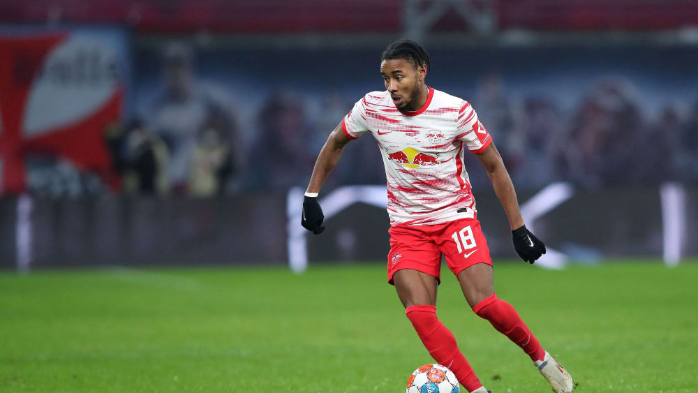 Leipzig's French midfielder Christopher Nkunku plays the ball during the German first division Bundesliga football match RB Leipzig vs Arminia Bielefeld, in Leipzig, eastern Germany, on December 18, 2021. - DFL REGULATIONS PROHIBIT ANY USE OF PHOTOGRAPHS AS IMAGE SEQUENCES AND/OR QUASI-VIDEO (Photo by Ronny Hartmann / AFP) / DFL REGULATIONS PROHIBIT ANY USE OF PHOTOGRAPHS AS IMAGE SEQUENCES AND/OR QUASI-VIDEO (Photo by RONNY HARTMANN/AFP via Getty Images)