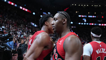 May 1, 2026; Toronto, Ontario, CAN; Toronto Raptors forward RJ Barrett (9) hugs forward Scottie Barnes (4) celebrates after scoring the winning basket against the Cleveland Cavaliers during the overtime period  in game six of the first round of the 2026 NBA Playoffs at Scotiabank Arena. Mandatory Credit: Nick Turchiaro-Imagn Images