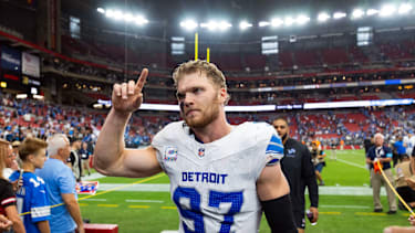 Oct 11, 2026; Glendale, Arizona, USA; Detroit Lions defensive end Aidan Hutchinson (97) celebrates as he walks off the field after defeating the Arizona Cardinals at State Farm Stadium. Mandatory Credit: Mark J. Rebilas-Imagn Images
